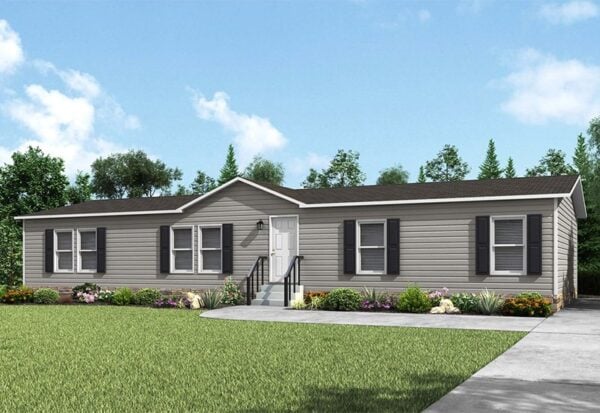 A single-story, gray manufactured home with black shutters, a small front porch, and a concrete driveway, surrounded by grass and landscaping.